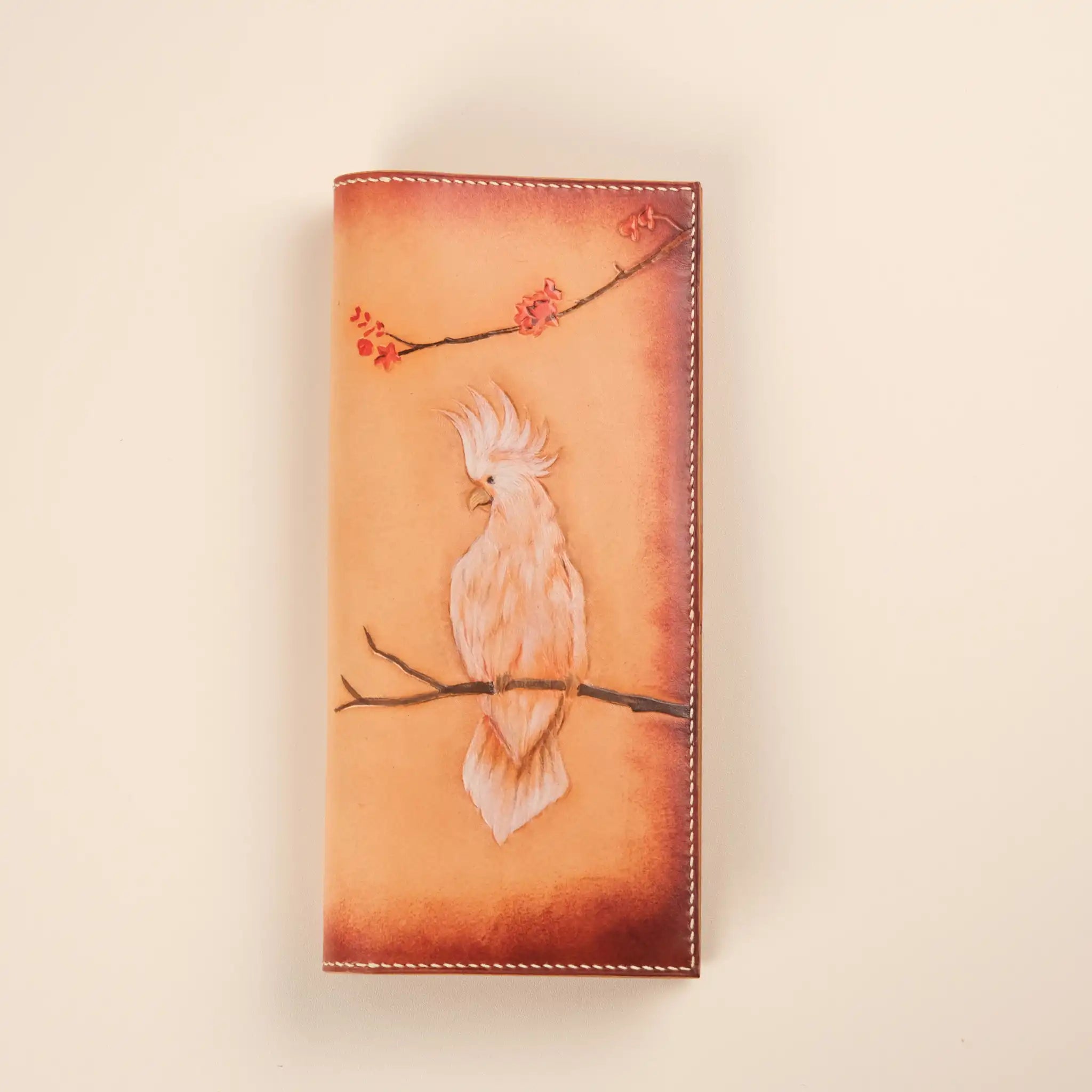 Wallet carved in the shape of a bird